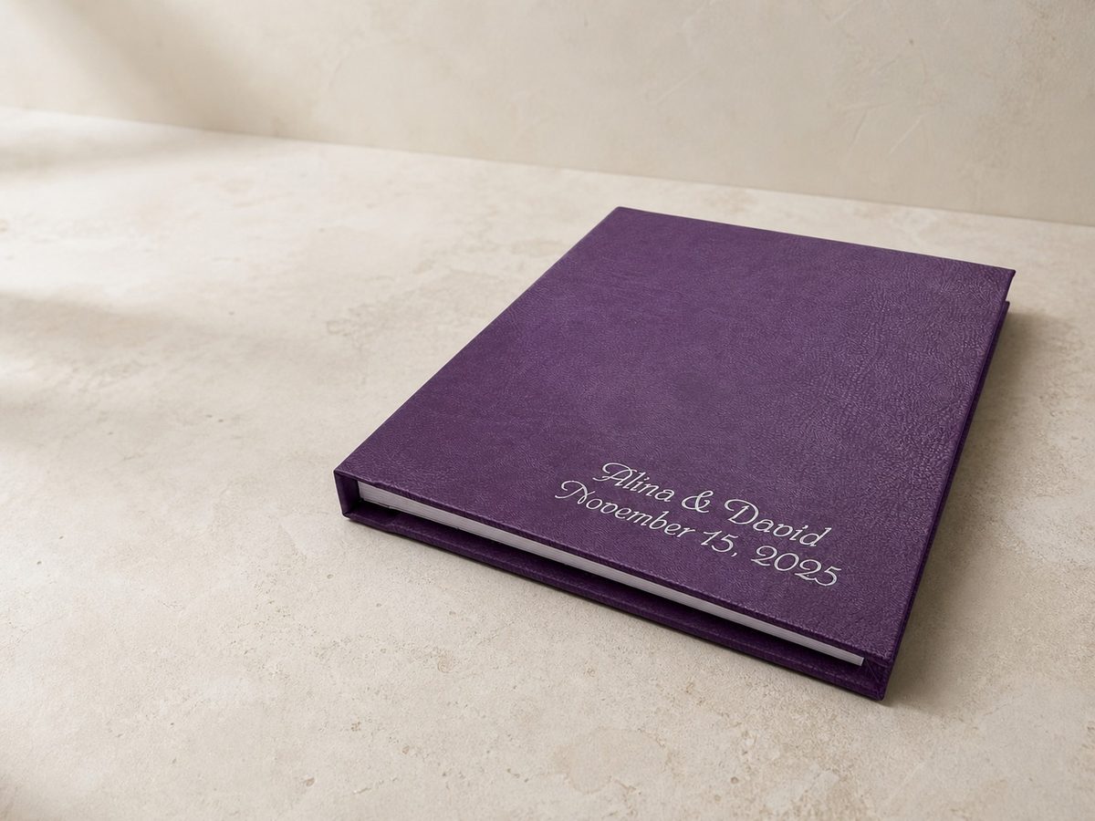 Purple leather album with a white UV imprint
